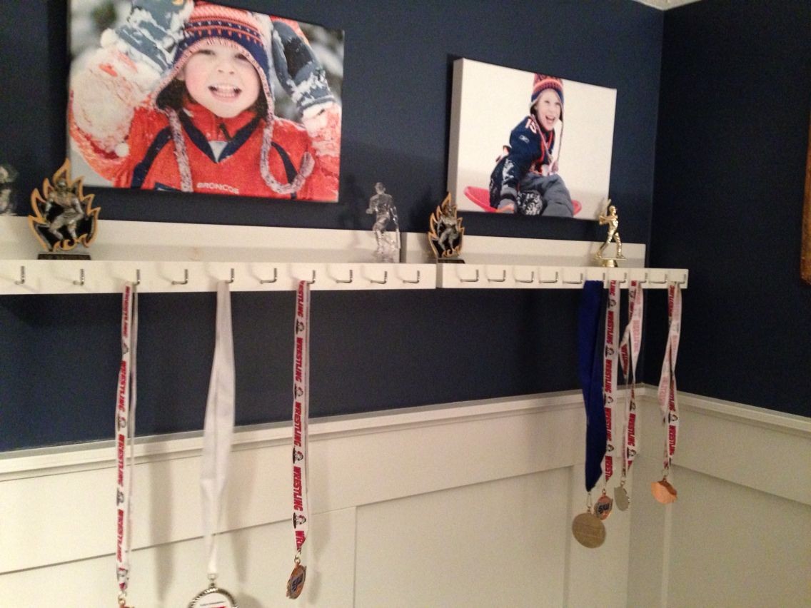 Medal and trophy display for the boys room - finally after a year of talking about it to them_).jpg